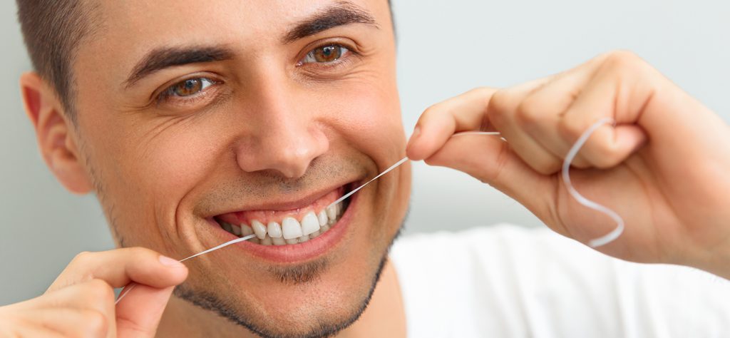 Cleaning teeth with dental floss